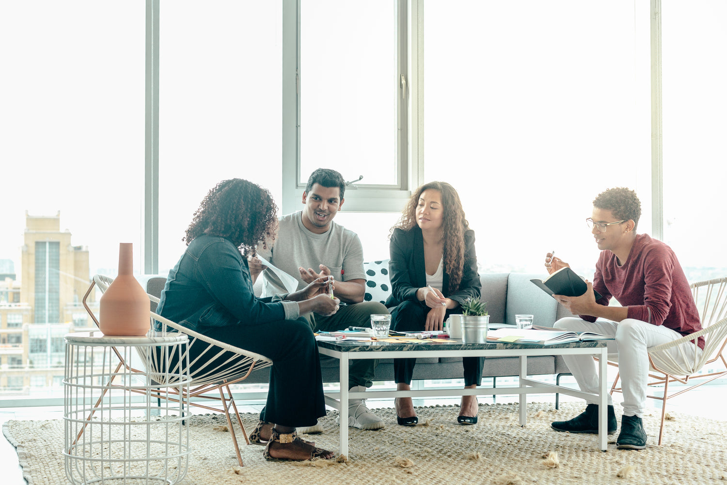 team-brainstorm-meeting-in-bright-sunny-office.jpg